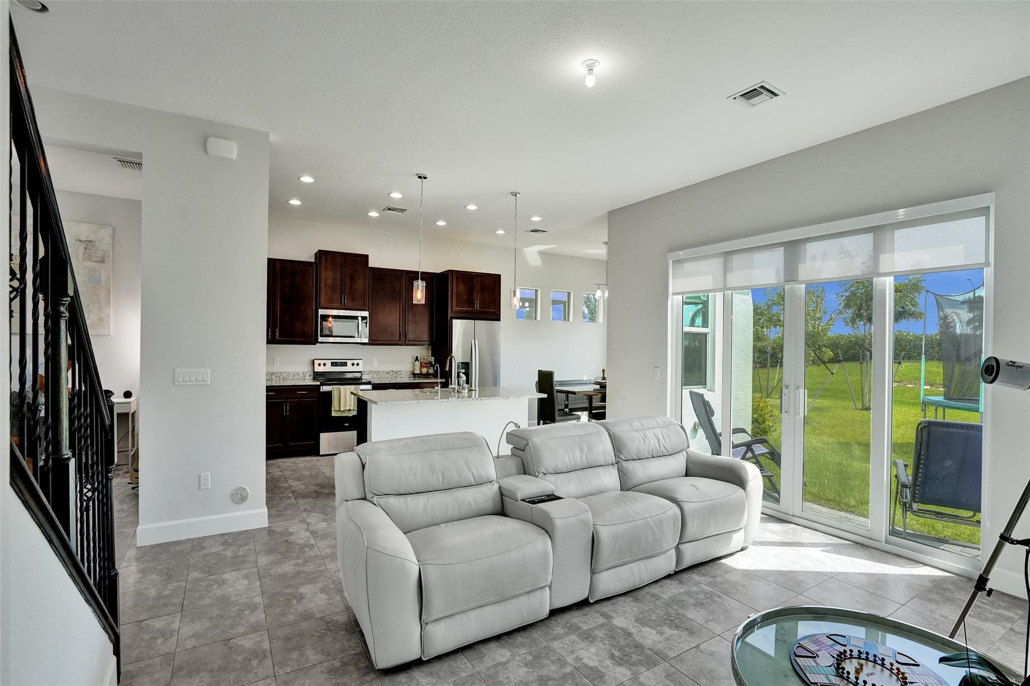 5416 Macoon Way Loxahatchee, FL 33470 - Photo 9 of 43 a living room with furniture and a large window