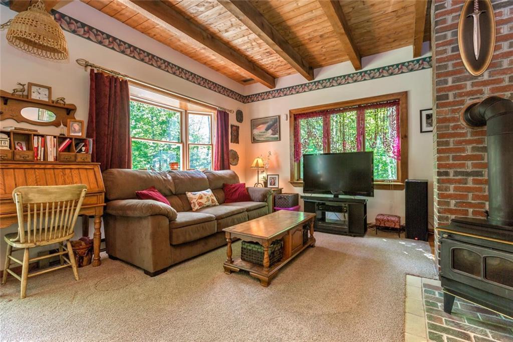 187 Harris Road Minot, ME 04258 - Photo 10 of 35 LR w/wood stove, what a lovely place...