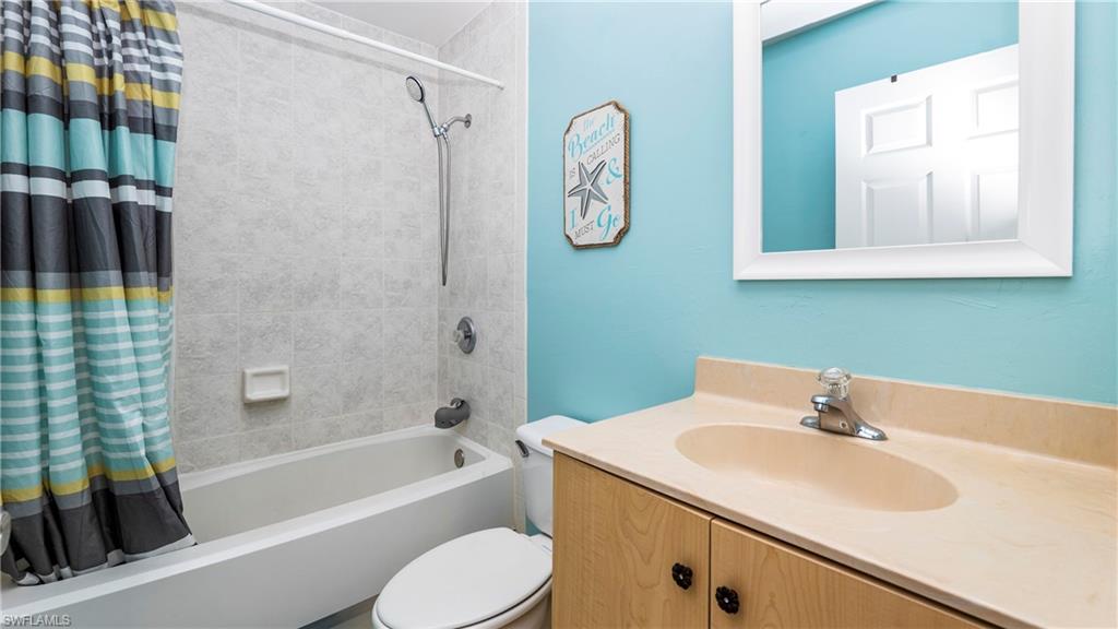 3340 2nd Avenue Southeast Naples, FL 34117 - Photo 17 of 24 a bathroom with a sink a toilet and shower