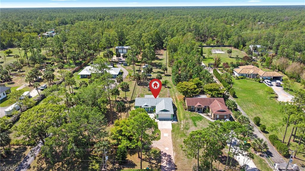 3340 2nd Avenue Southeast Naples, FL 34117 - Photo 2 of 24 an aerial view of residential houses with outdoor space and trees