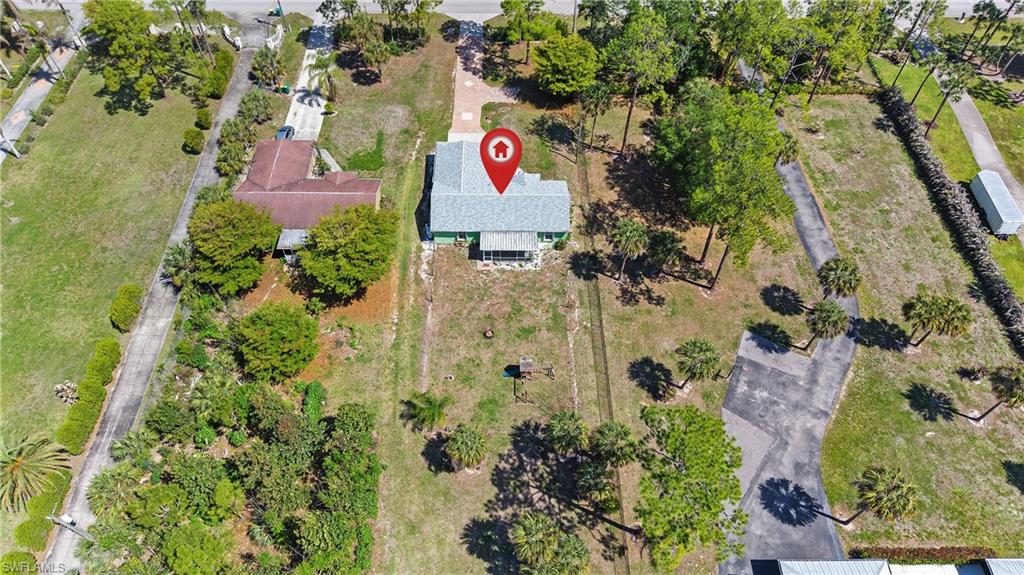 3340 2nd Avenue Southeast Naples, FL 34117 - Photo 23 of 24 an aerial view of residential house with sign and trees