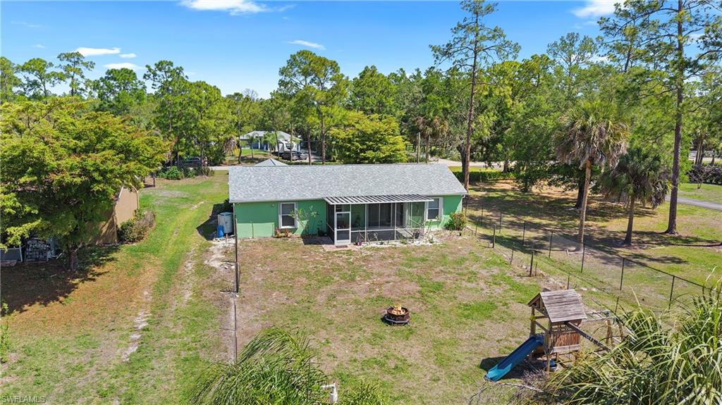 3340 2nd Avenue Southeast Naples, FL 34117 - Photo 24 of 24 a view of a house with a yard