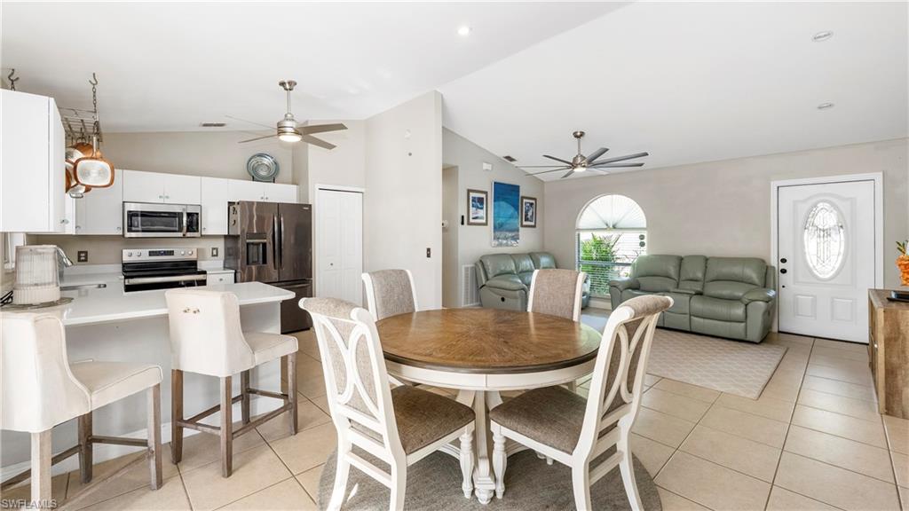 3340 2nd Avenue Southeast Naples, FL 34117 - Photo 6 of 24 a view of a dining room with furniture