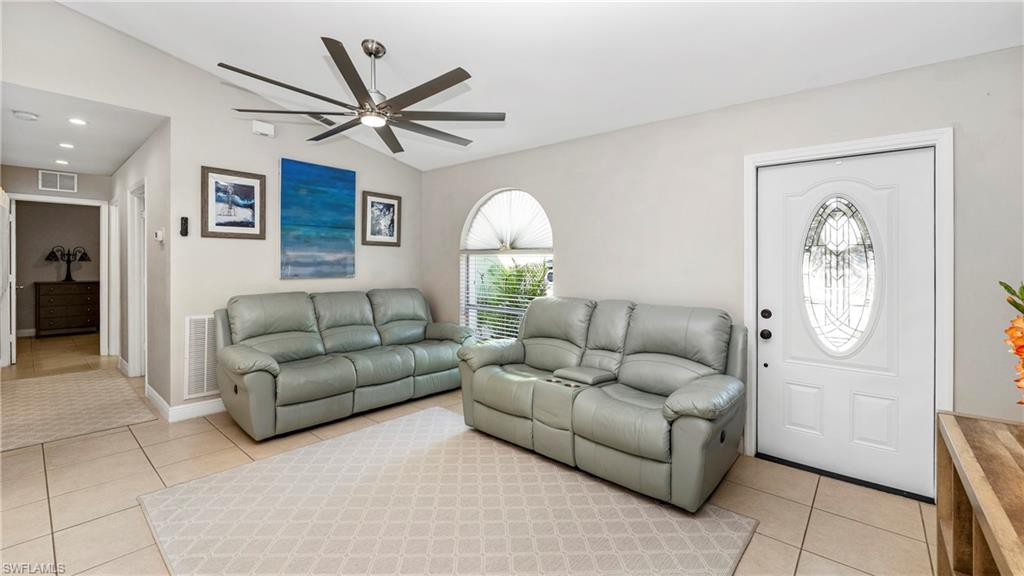3340 2nd Avenue Southeast Naples, FL 34117 - Photo 9 of 24 a living room with furniture and a window