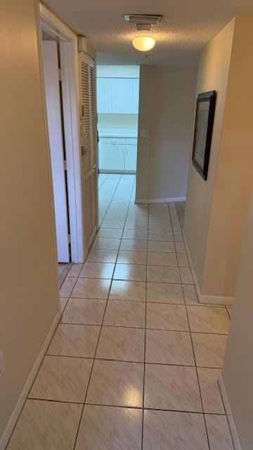 2334 South Cypress Bend Drive, Unit 204 Pompano Beach, FL 33069 - Photo 2 of 25 a view of walk in closet with clothes