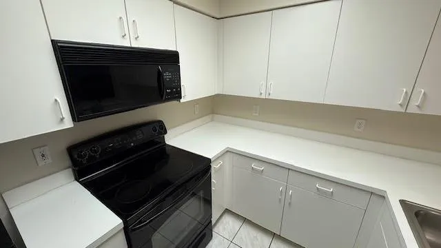 a kitchen with a stove and a microwave