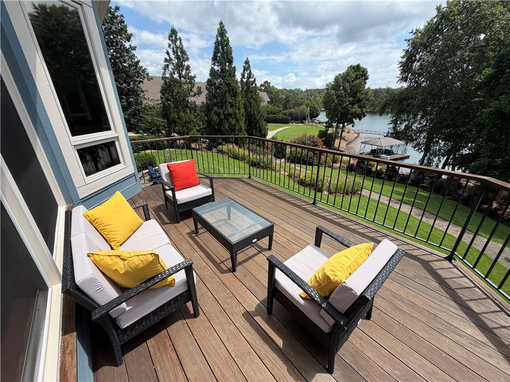 357 Stardust Lane Seneca, SC 29672 - Photo 19 of 50 Upper Deck -An elevated wood deck overlooks manicured lawns and serene water views.