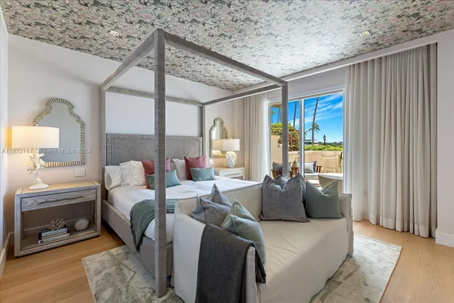 a view of living room with furniture and a large window