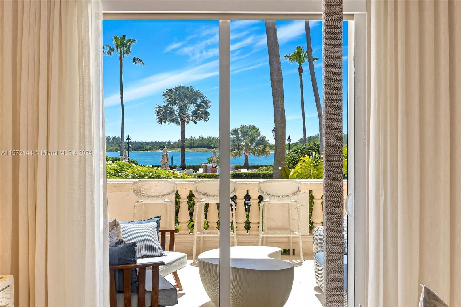 2113 Fisher Island Drive, Unit 2113 Miami Beach, FL 33109 - Photo 19 of 49 a view of a dining room with furniture window and outside view