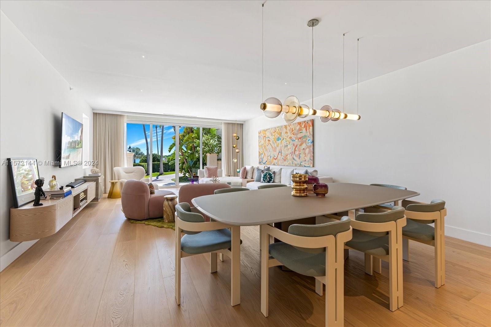 2113 Fisher Island Drive, Unit 2113 Miami Beach, FL 33109 - Photo 6 of 49 a view of a dining room with furniture window and wooden floor