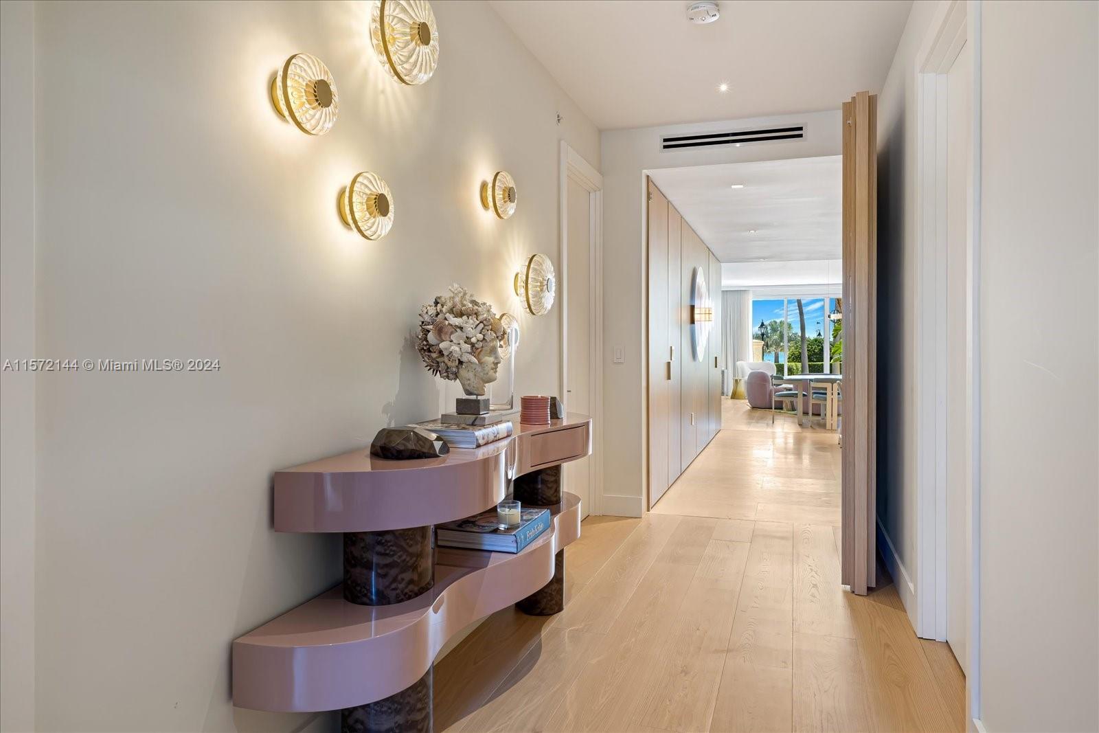 2113 Fisher Island Drive, Unit 2113 Miami Beach, FL 33109 - Photo 9 of 49 a dining room with furniture and wooden floor