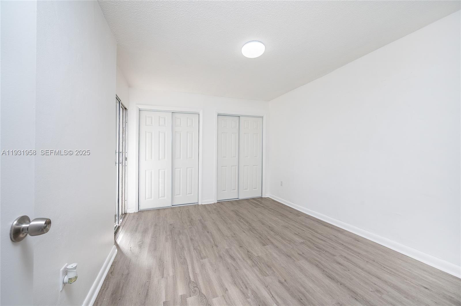 444 Southwest 27th Avenue, Unit 37 Miami, FL 33135 - Photo 12 of 18 a view of room with hardwood floor