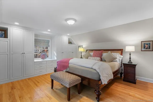 a bedroom with a bed and a couch