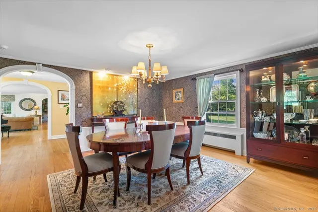 a view of a dining room with furniture window and wooden floor