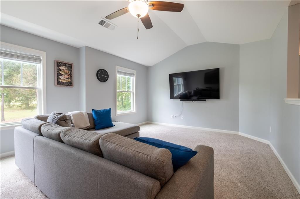 719 Fairview Road Brooks, GA 30205 - Photo 29 of 35 a living room with furniture and a flat screen tv