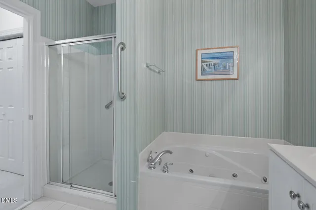a bathroom with a double vanity sink mirror and toilet