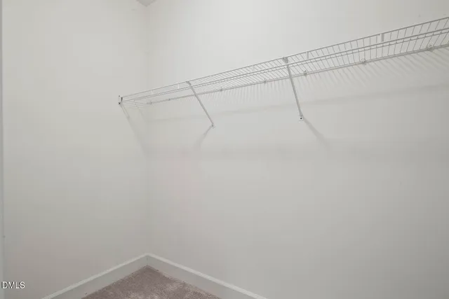 a view of a bathroom from a hallway