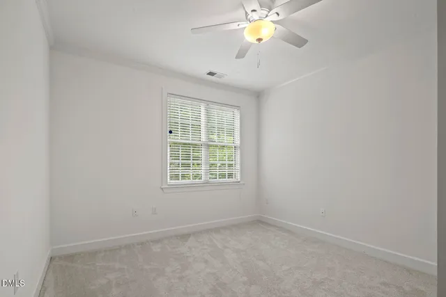 an empty room with closet area