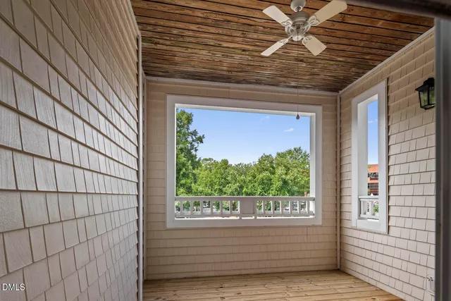 a view of room with wooden floor