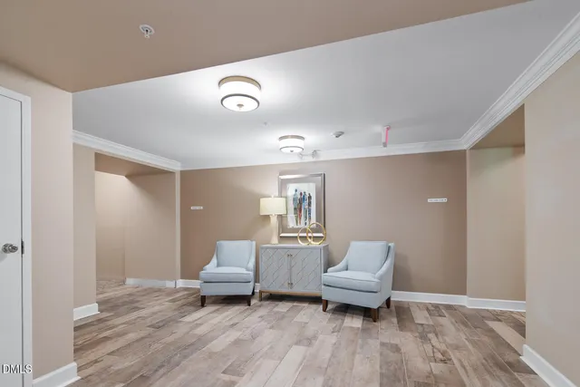 a view of an entryway with wooden floor