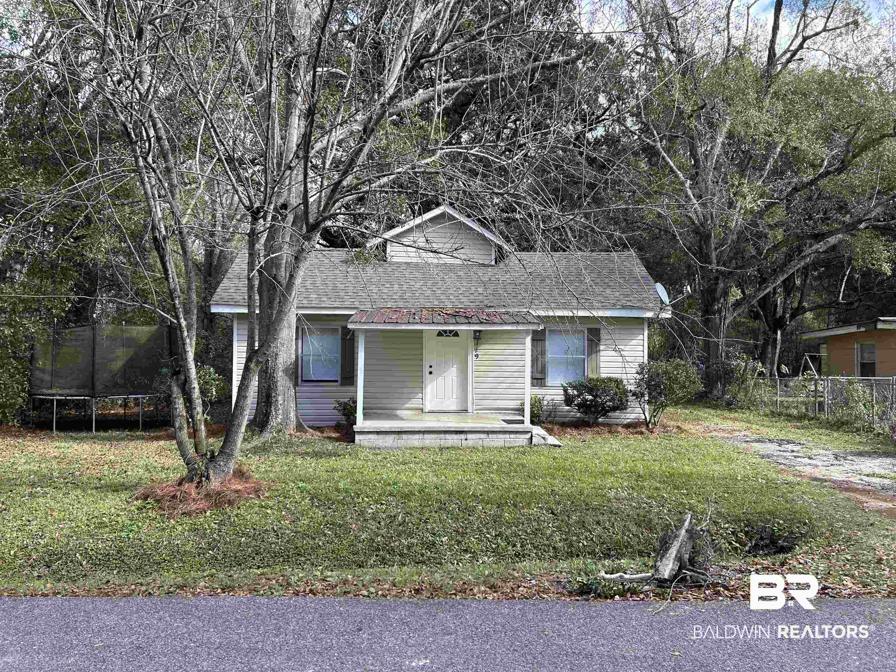 2119 Hoppin Street Mobile, AL 36605 - Photo 1 of 23 View of front of house featuring a trampoline and a front lawn