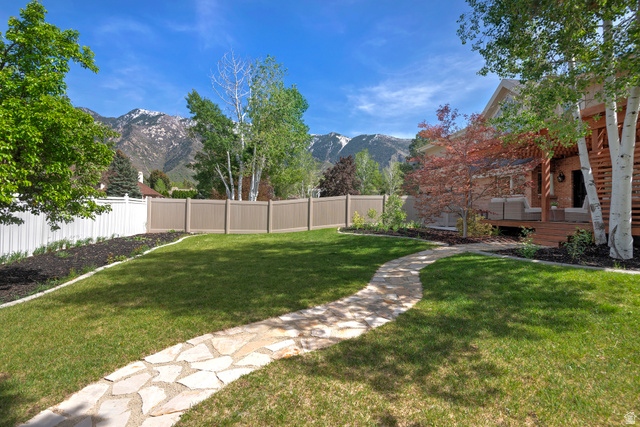 16 Gatehouse Lane Sandy, UT 84092 - Photo 56 of 73 Fenced backyard featuring a deck with mountain view