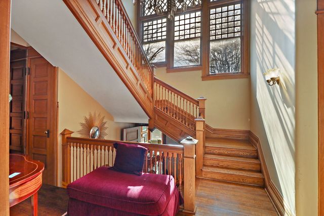 a view of entryway with wooden floor and stairs