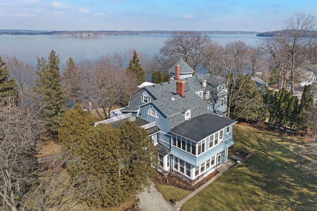 a aerial view of a house with a lake view