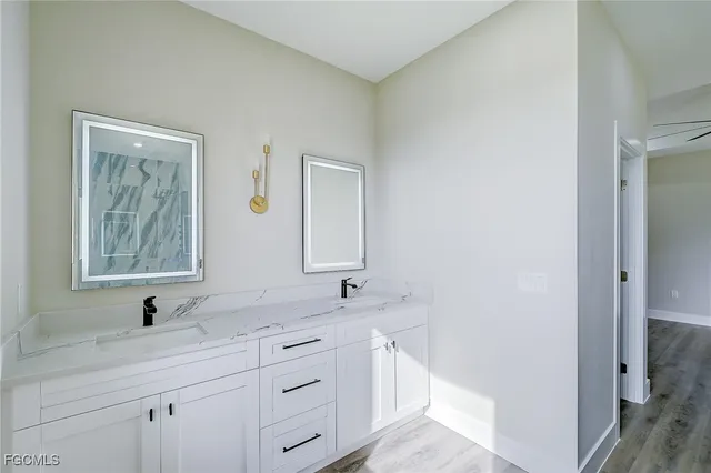 a bathroom with a sink and a mirror