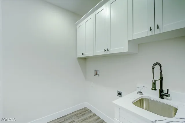 a bathroom with a sink and cabinets