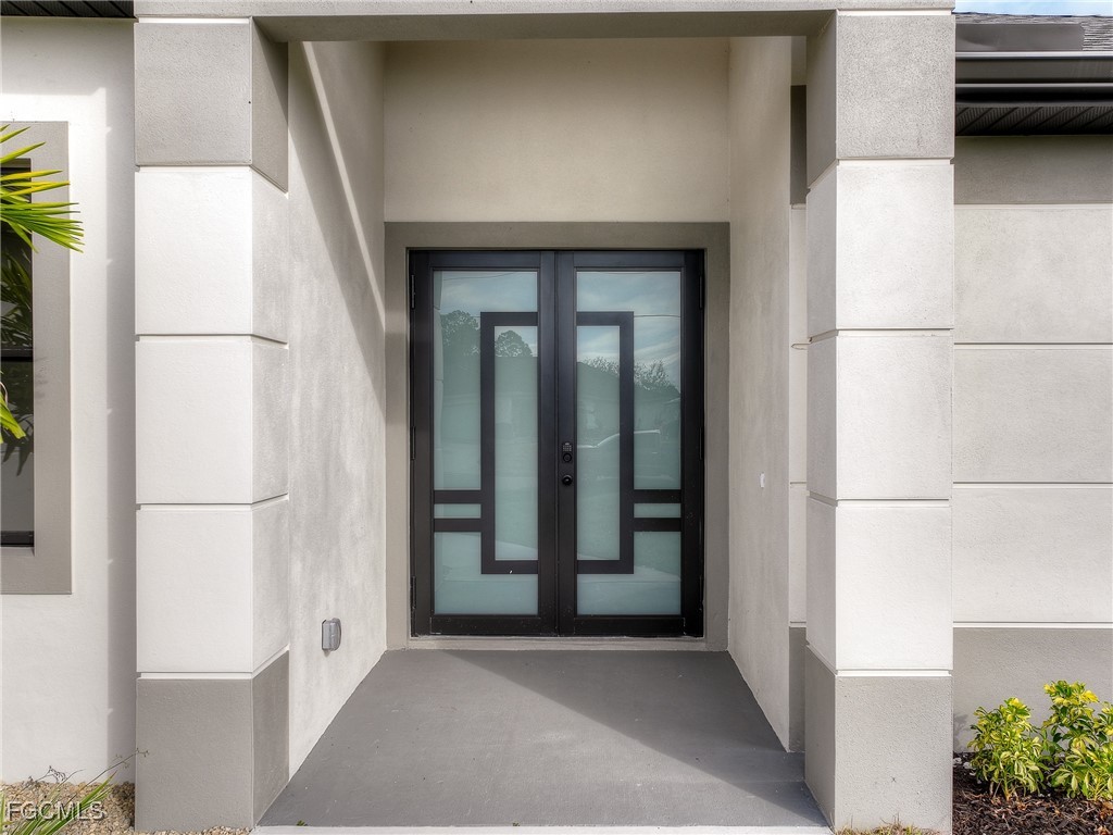 3108 20th Street Southwest Lehigh Acres, FL 33976 - Photo 4 of 36 a view of entryway with a hallway