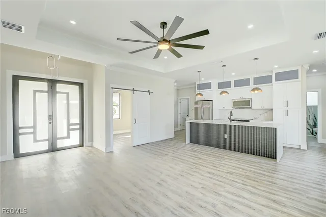 a view of a kitchen with a sink and a window