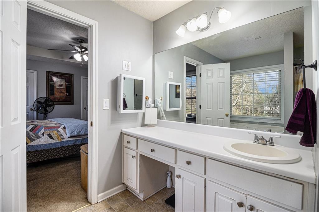 118 Manning Mill Road Adairsville, GA 30103 - Photo 12 of 19 a en suite bathroom with a sink double vanity and a mirror