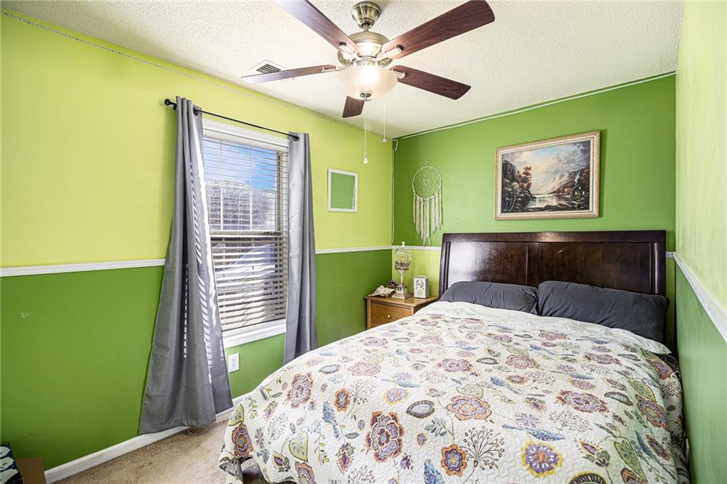 118 Manning Mill Road Adairsville, GA 30103 - Photo 17 of 19 a bedroom with a bed and a window