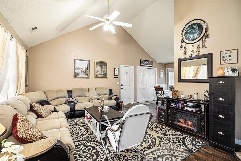 118 Manning Mill Road Adairsville, GA 30103 - Photo 7 of 19 a living room with furniture a clock on wall and a window