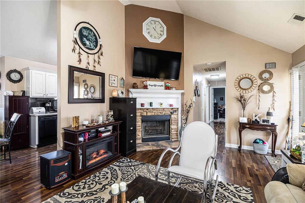 118 Manning Mill Road Adairsville, GA 30103 - Photo 8 of 19 a living room with furniture a flat screen tv and a fireplace