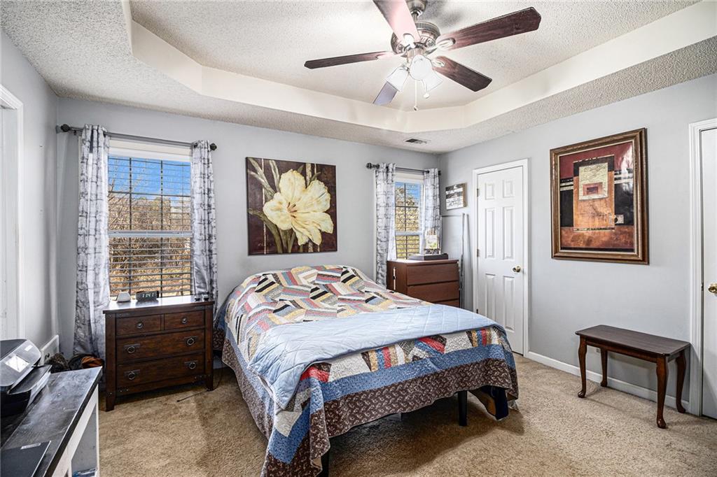 118 Manning Mill Road Adairsville, GA 30103 - Photo 9 of 19 a bedroom with a bed a dresser and chair