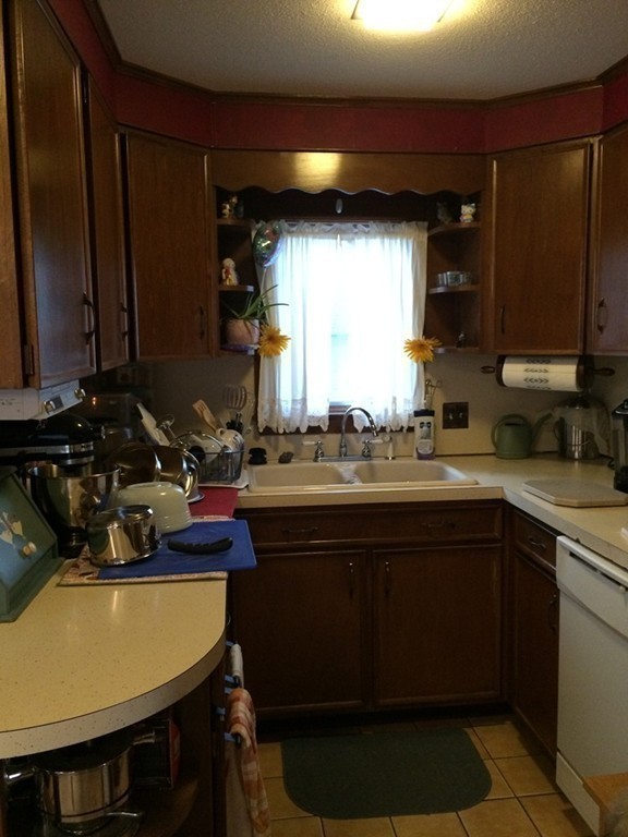 82 Wilber Street Springfield, MA 01104 - Photo 14 of 22 a kitchen with a sink appliances and cabinets