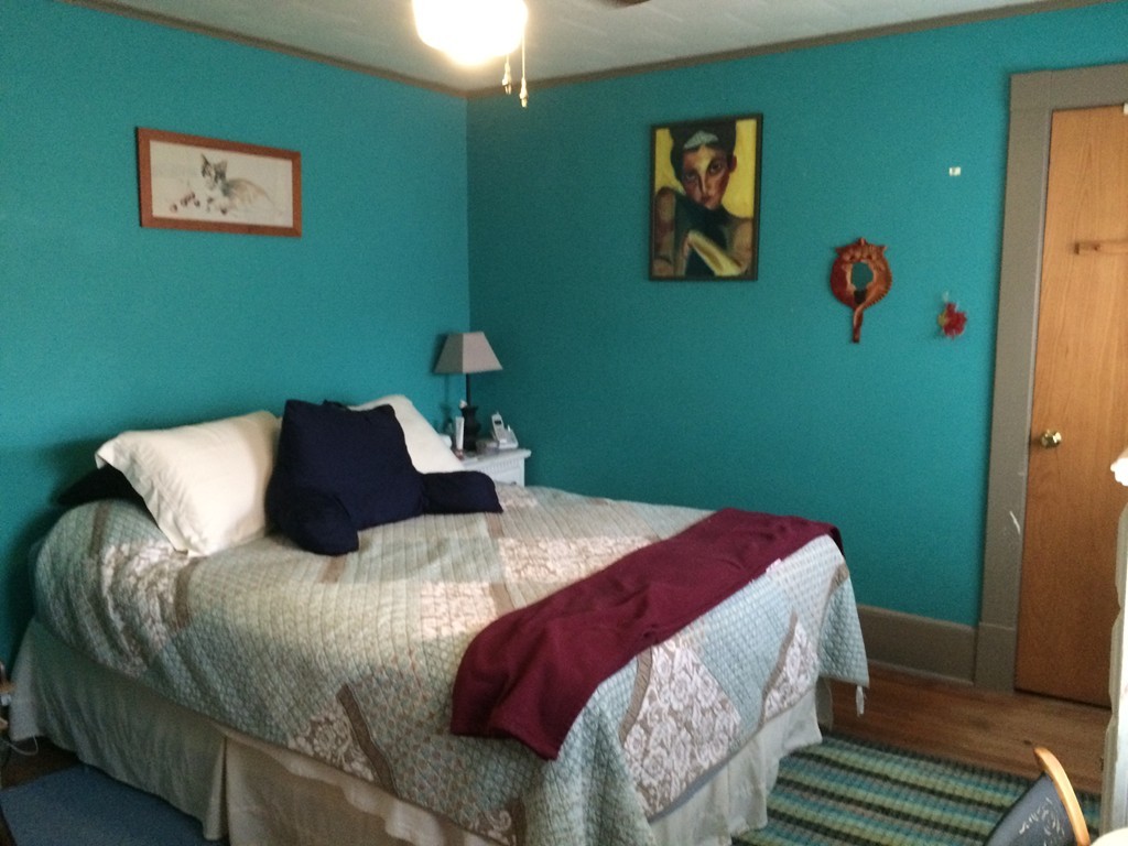 82 Wilber Street Springfield, MA 01104 - Photo 17 of 22 a bedroom with a bed and a window