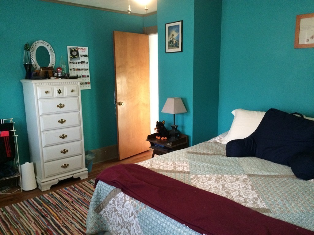 82 Wilber Street Springfield, MA 01104 - Photo 18 of 22 a bedroom with a bed and a dresser