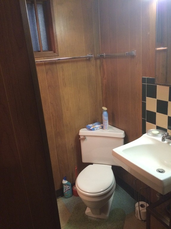 82 Wilber Street Springfield, MA 01104 - Photo 21 of 22 a white toilet sitting next to a bathroom sink