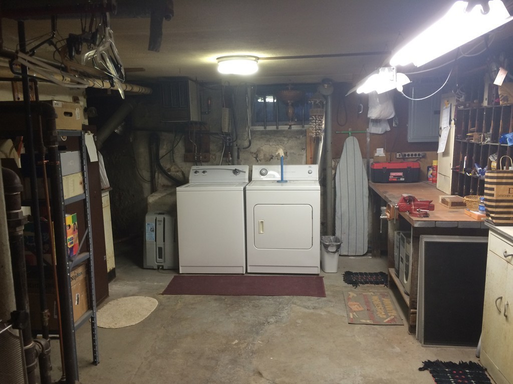 82 Wilber Street Springfield, MA 01104 - Photo 22 of 22 a view of a storage & utility room with washer and dryer