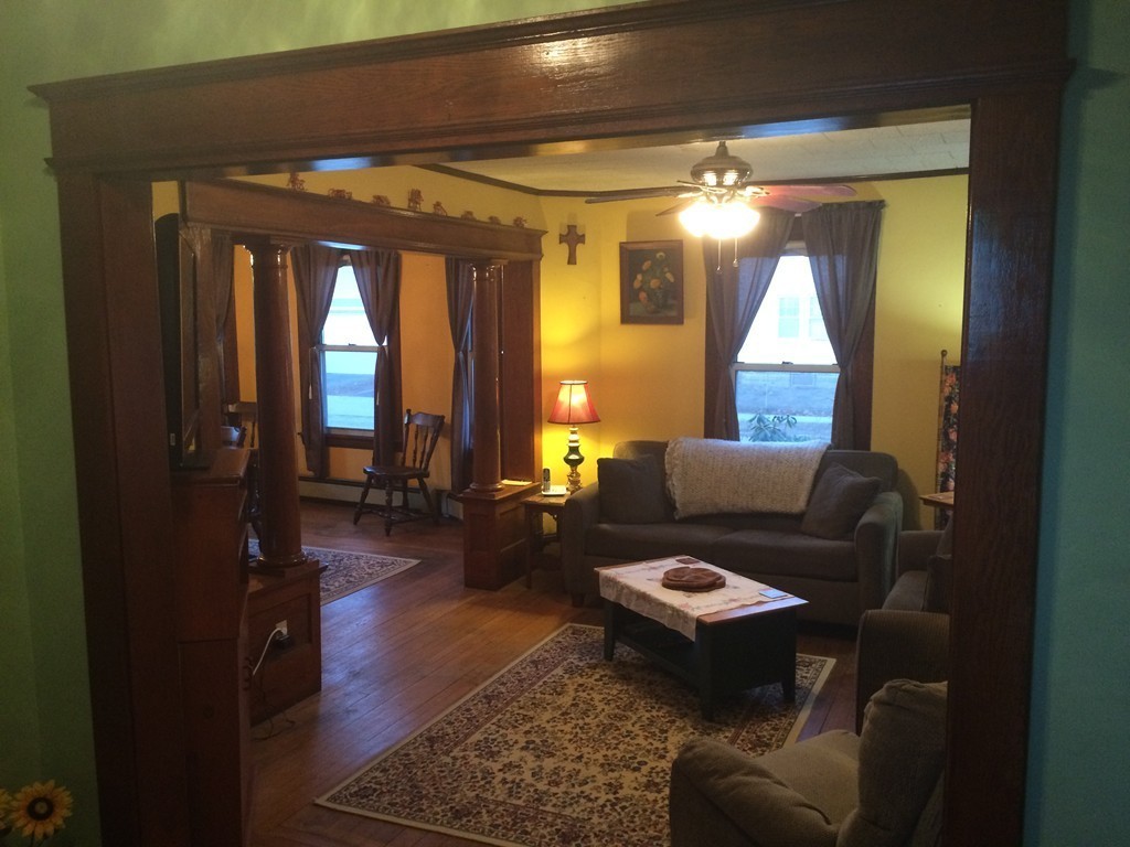 82 Wilber Street Springfield, MA 01104 - Photo 9 of 22 a living room with furniture and a large window