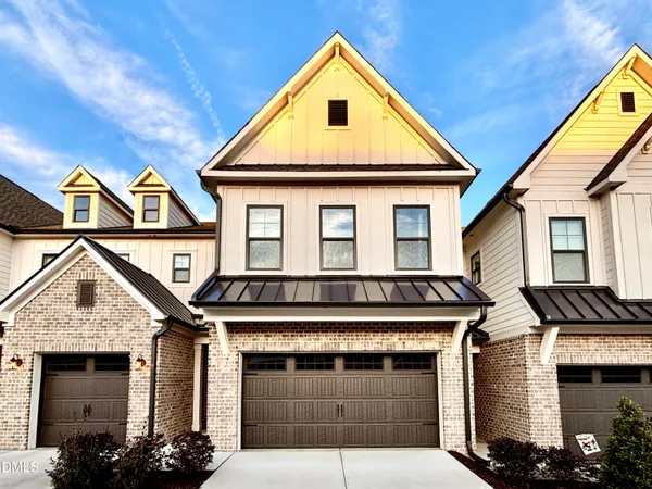 a front view of a house with a garage