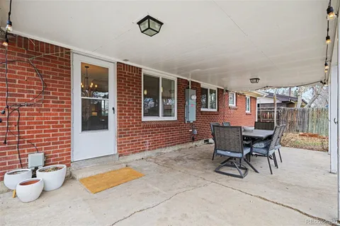 a outdoor space with a couch and chairs