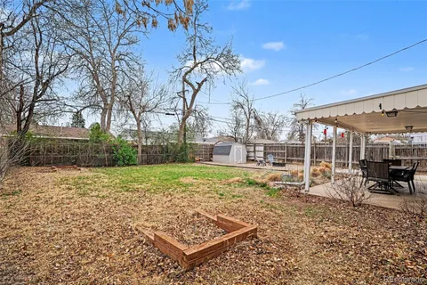 a view of a backyard with sitting area