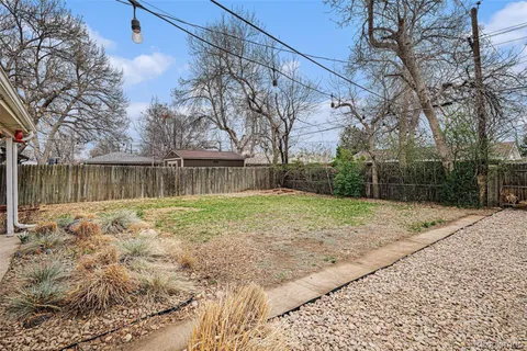 a backyard of a house with a swing