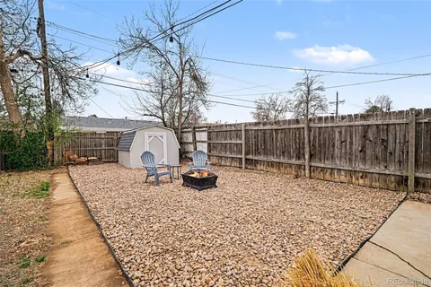 a view of a backyard with a bench