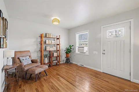 a view of a livingroom with furniture and wooden floor