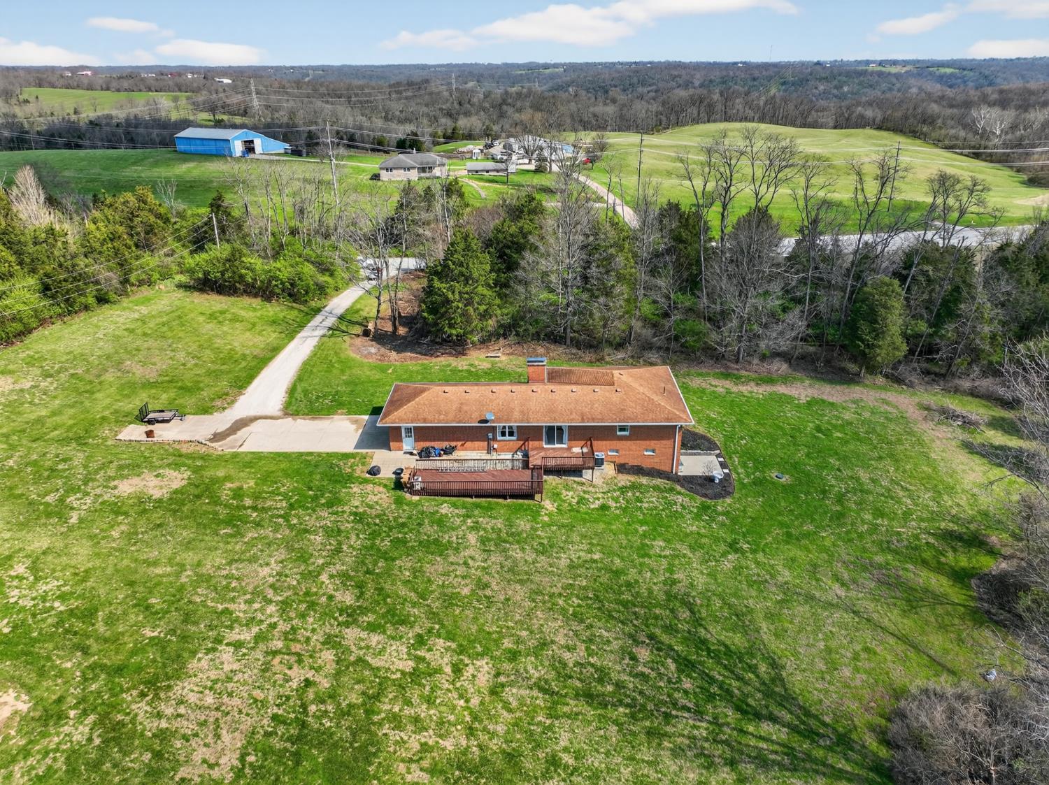 8093 Highway 350 Aurora, IN 47001 - Photo 1 of 50 Wonderfully maintained brick-ranch home with privacy, room to roam' hunt or appreciate the wildlife. There is plenty of space for a large garden as well as entertaining. With over 17+ acres, the serence space is your oyster to make it almost anything you desire. There are also two lots witin the property that are makred for building if you desire to use for family, guest house, future investment , or even sell.